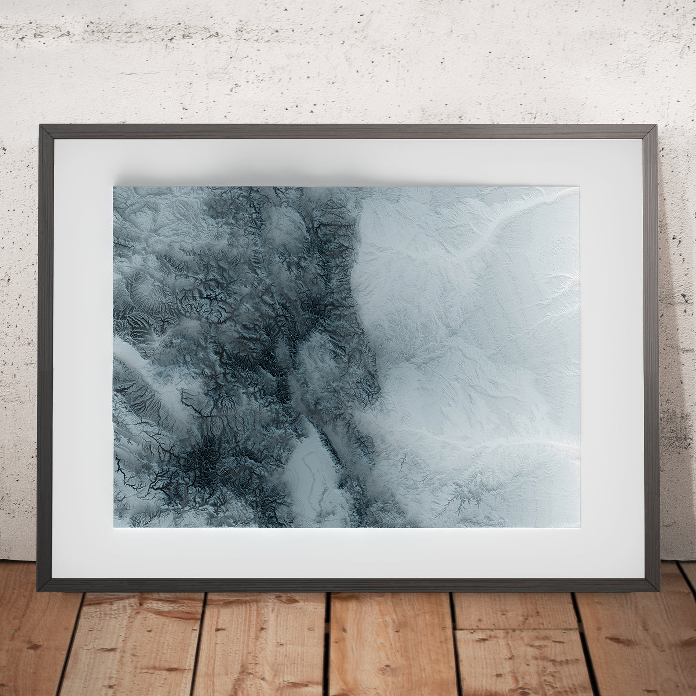 A framed image of a 3D style topographic relief map ofColorado